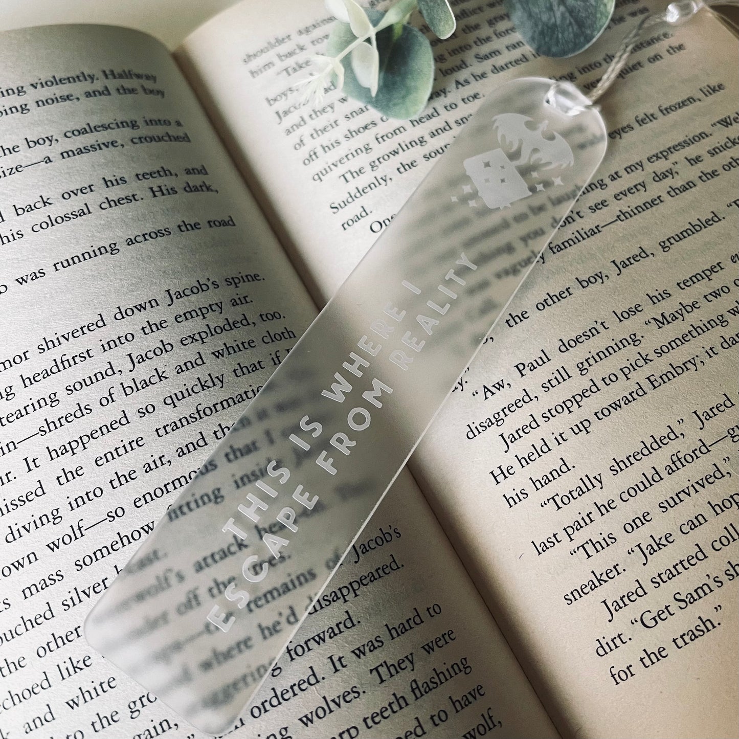 Clear bookmark with text on an open book