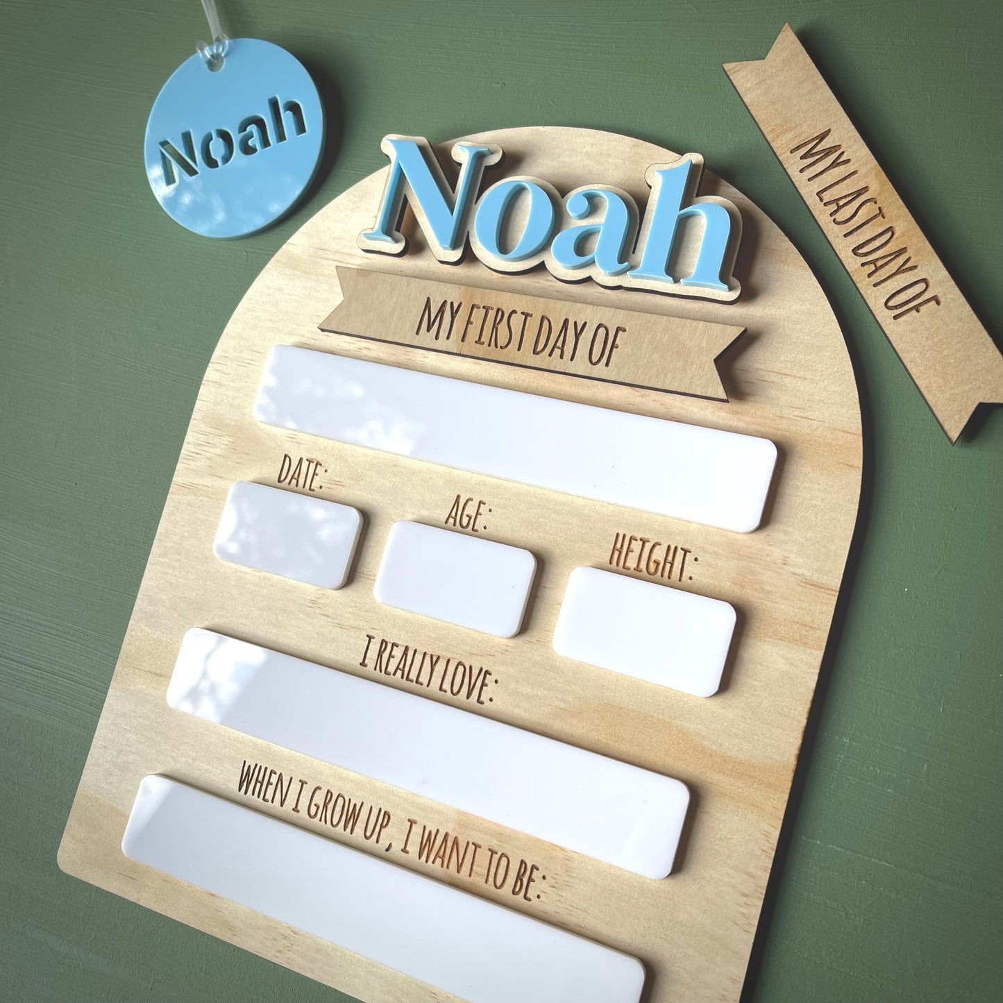 Wooden plaque with 'Noah' on a green background